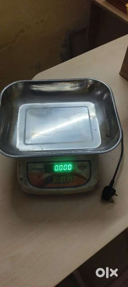 Weighing machine scale