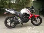 Yamaha FZS single hand driving.