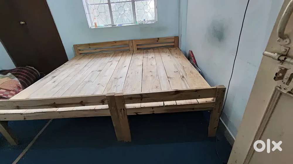 Two wooden  cots