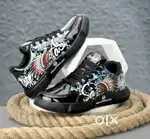 Bold glossy sneakers with tribal art, luxe style, and all-day comfort.