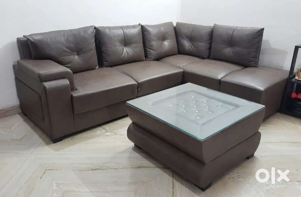 5 seater modern looking sofa with centre table.