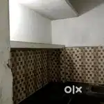 Big room attached kitchen with bed fan