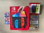 Nintendo Switch + 2 extra Controllers + 2 games