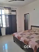 Ground floor ac furnished room with bed invator gzeer table chair etc