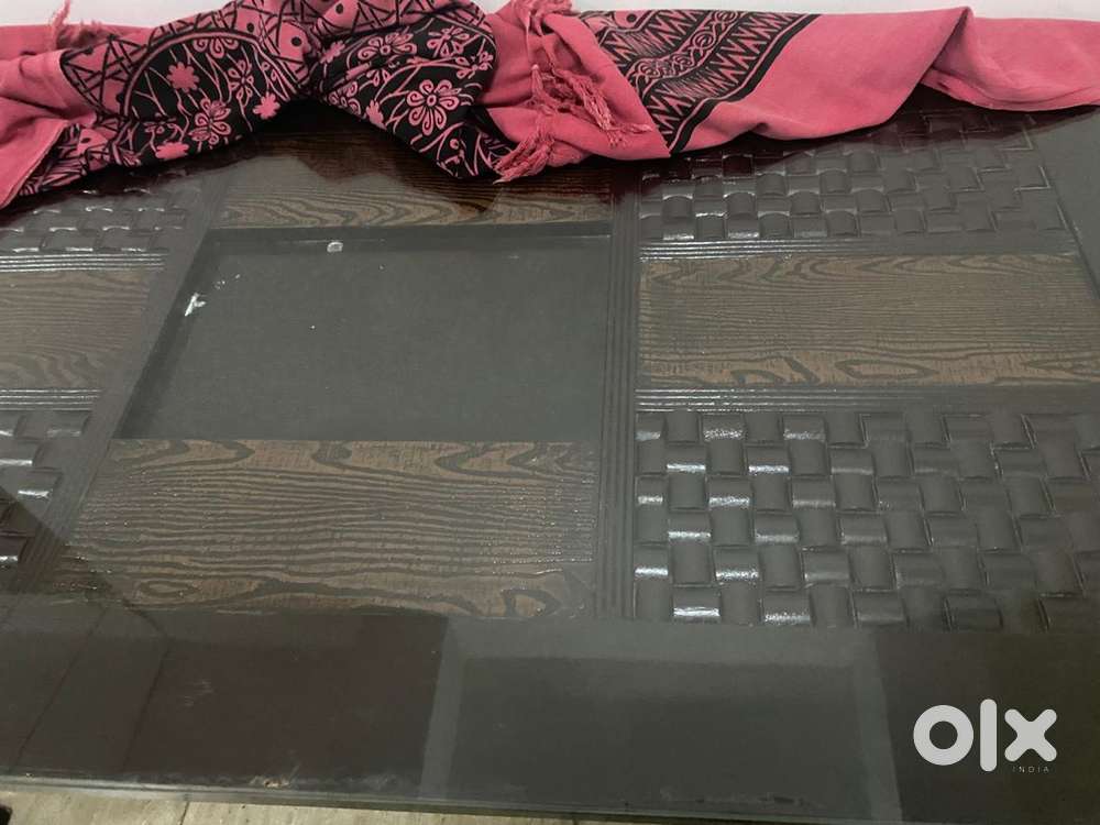 Wooden dinning table with glass top