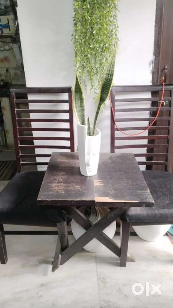 Wooden chairs with coffe n breakfast table