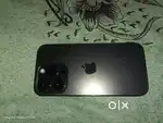 iPhone 14 pro with charger and two phone covers