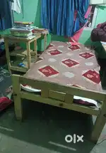 Wooden bed and wooden table..