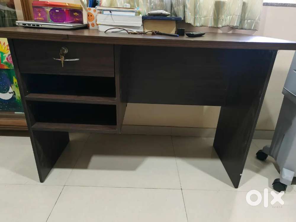 Wooden table. One drawer with lock and key and 2 open compartment