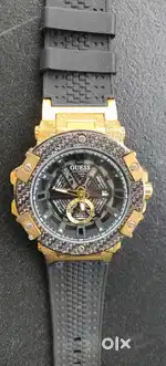 Guess Luxury Men’s Gold & Black Analog Watch  Bold Premium Design