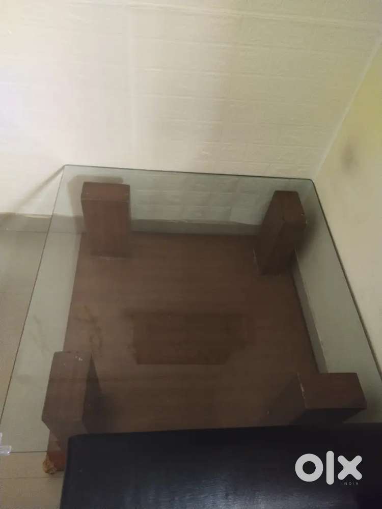 Wooden centre table with glass top