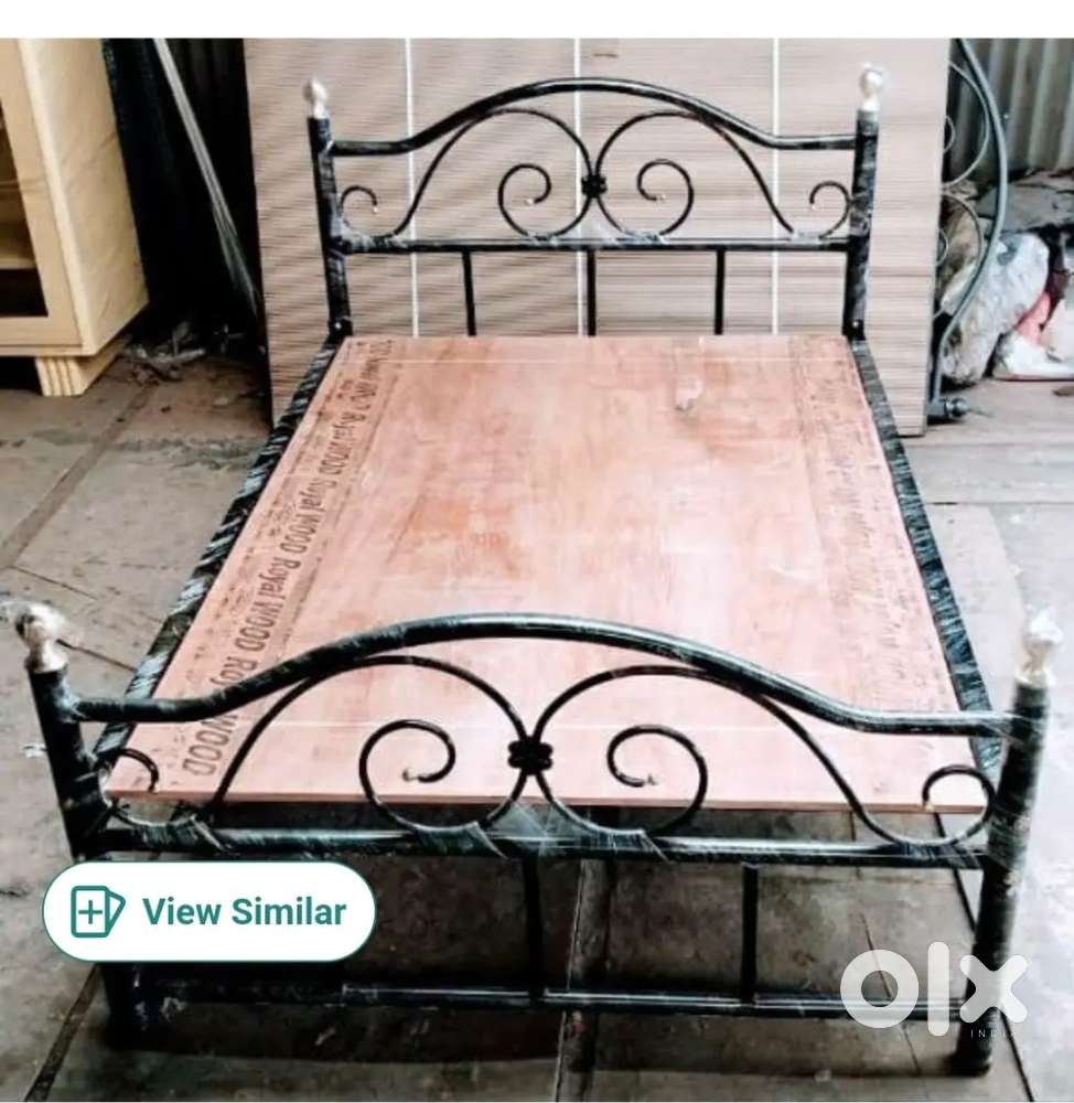 Iron and plywood cot