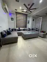 11-seater sofa set with big center table: 9-seater sofa + 2 puffy