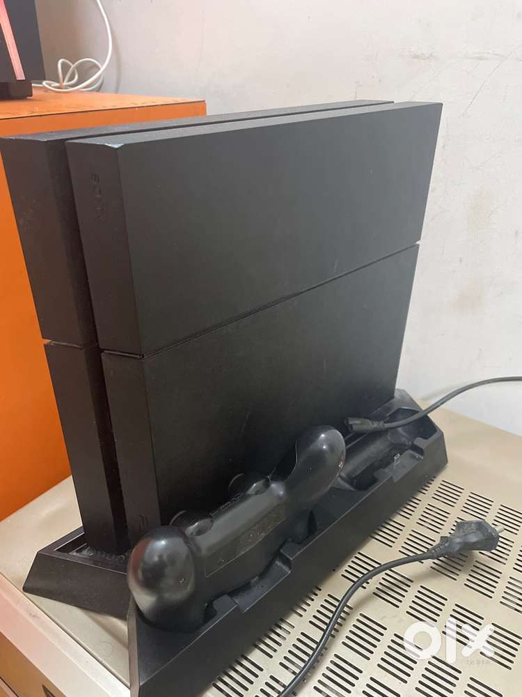 Ps4 with controllr 3 games and a cooling stand