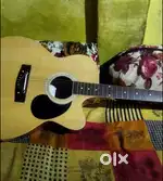Acoustic Guitar 4th month old