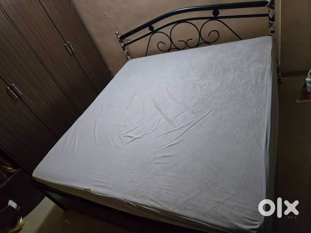 Selling King size metal bed with box storage in good condition