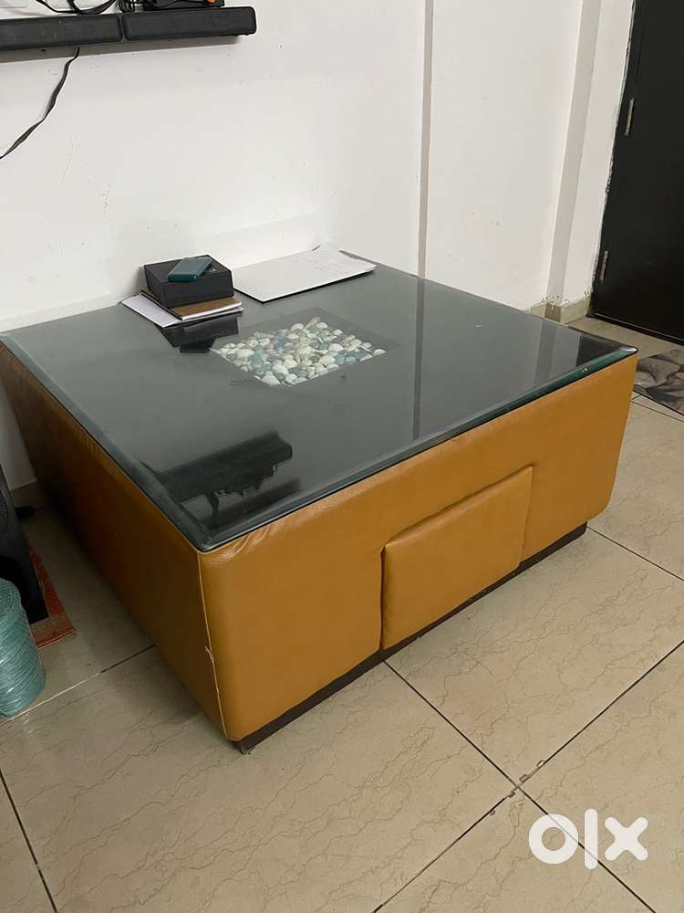 5 seater sofa with 2 recliners along with glass center table
