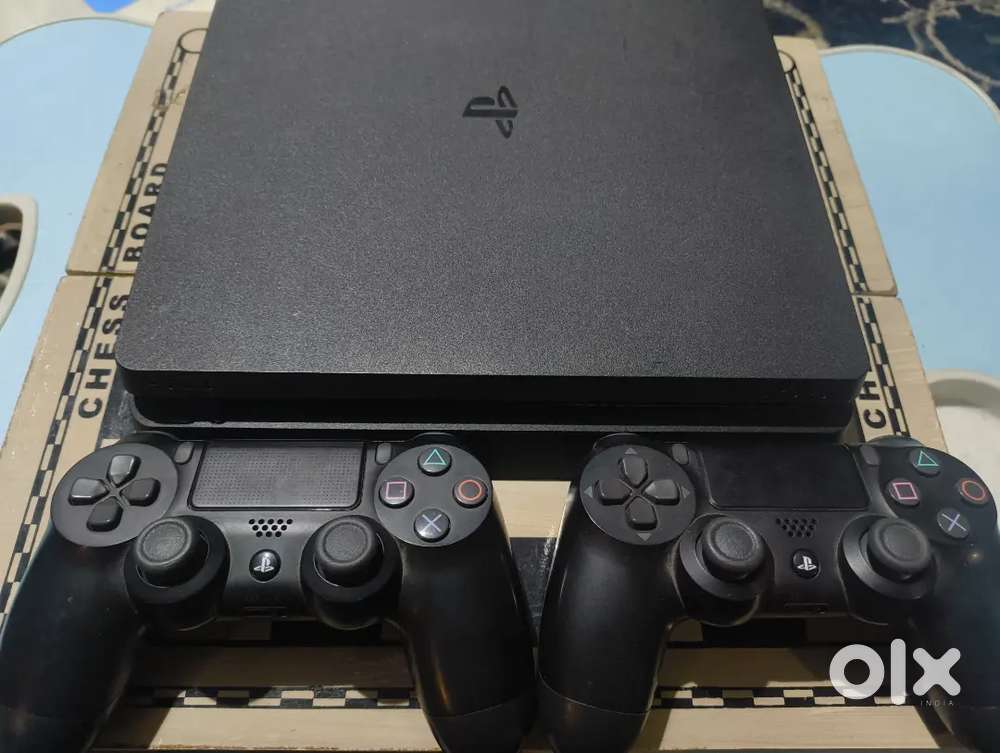 PS4 Slim 1TB  2 Controllers  GTA 5, Spider-Man, COD MW, FIFA 19,