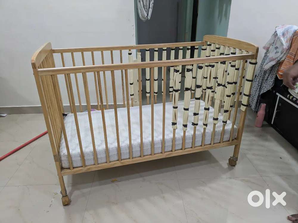 Fisher price beige color crib, mattress, mosquito net & safety net