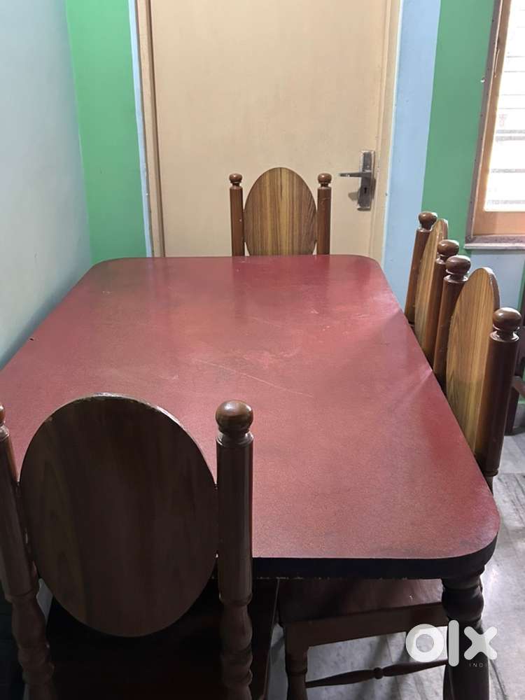 Wooden Dining table with four wooden chairs