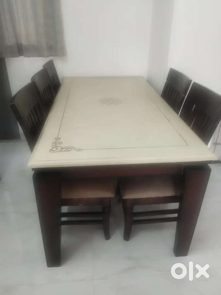 Dinning table with 6 chairs. Marble top good Condition
