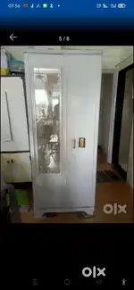 L SHAPE SOFA CUM BED AND metal CUPBOARD