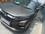 Fronx hybrid grey colour .I am owner so I need genuine customer. Alloy