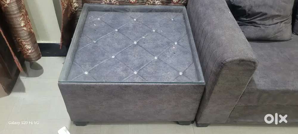 Corner sofa with centre table