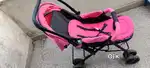 Babyhug stroller with reversible handle.