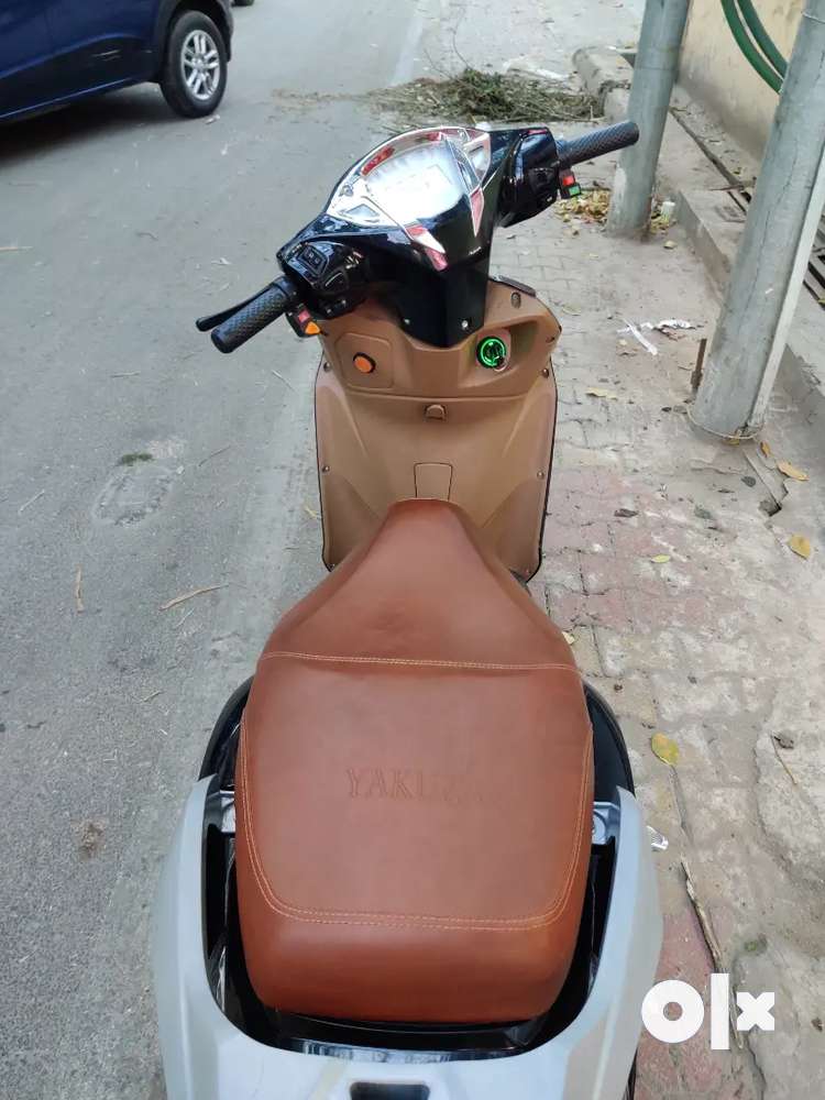 Yakuza electric scooter next to showroom condition