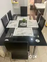 Dining table with chairs branded steel with black glass
