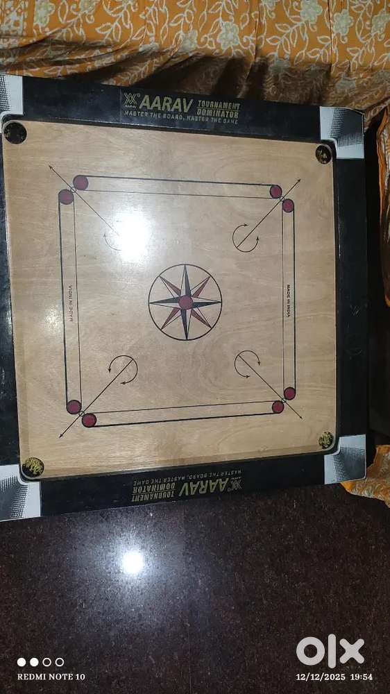 Carrom board with stricker and stand