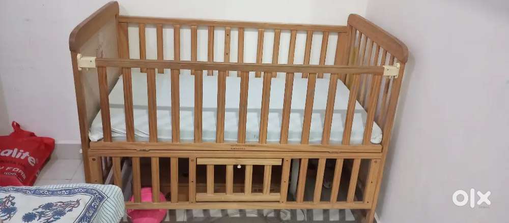 Baby cot bed and 2 chair sofa set along with center table