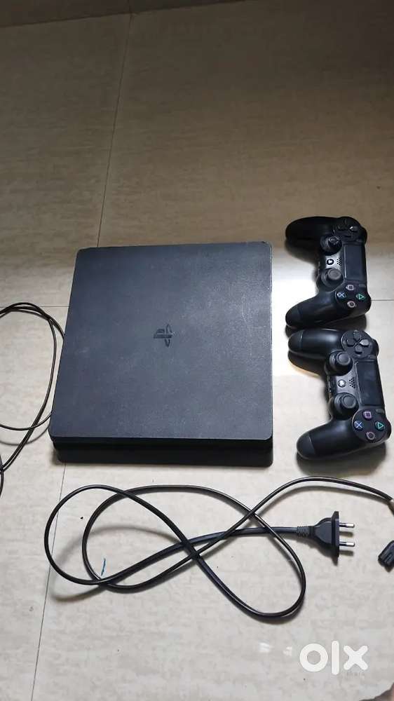 Sony PlayStation 4 with controller and games
