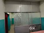 Aluminium room partition with one sided mirror and two set of benches