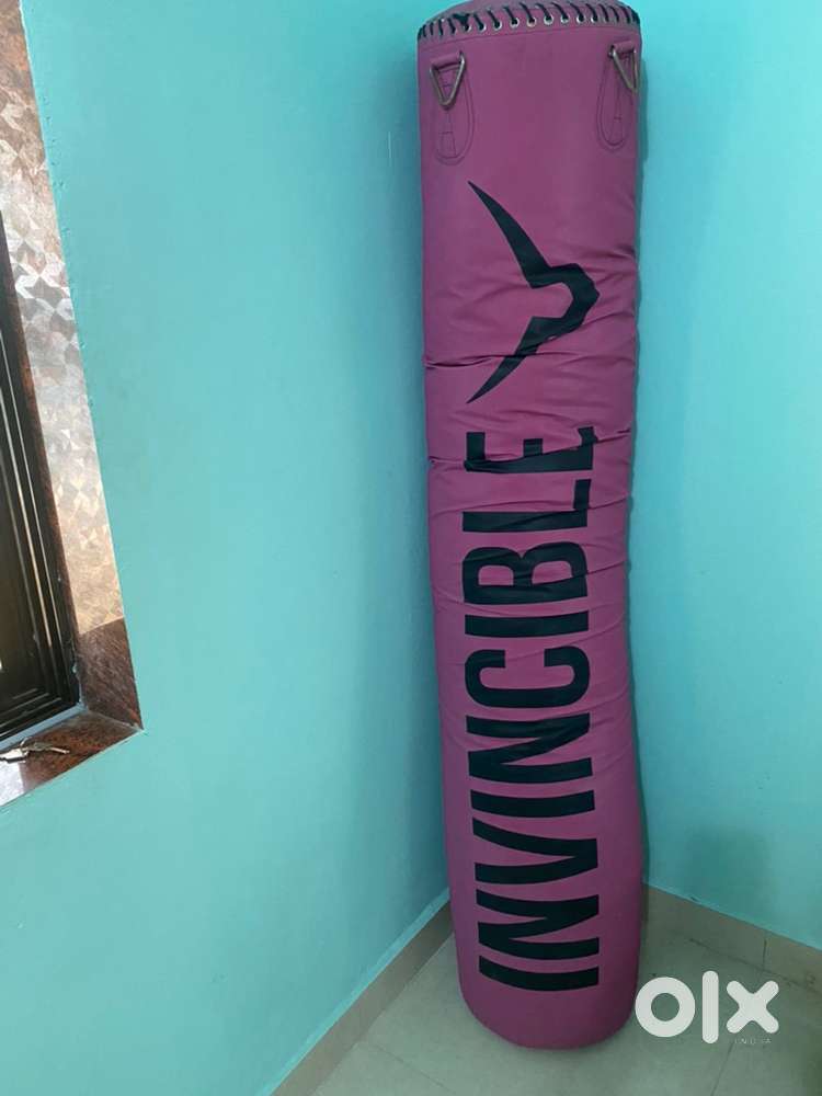 Punching bag, weight plates, battle rope