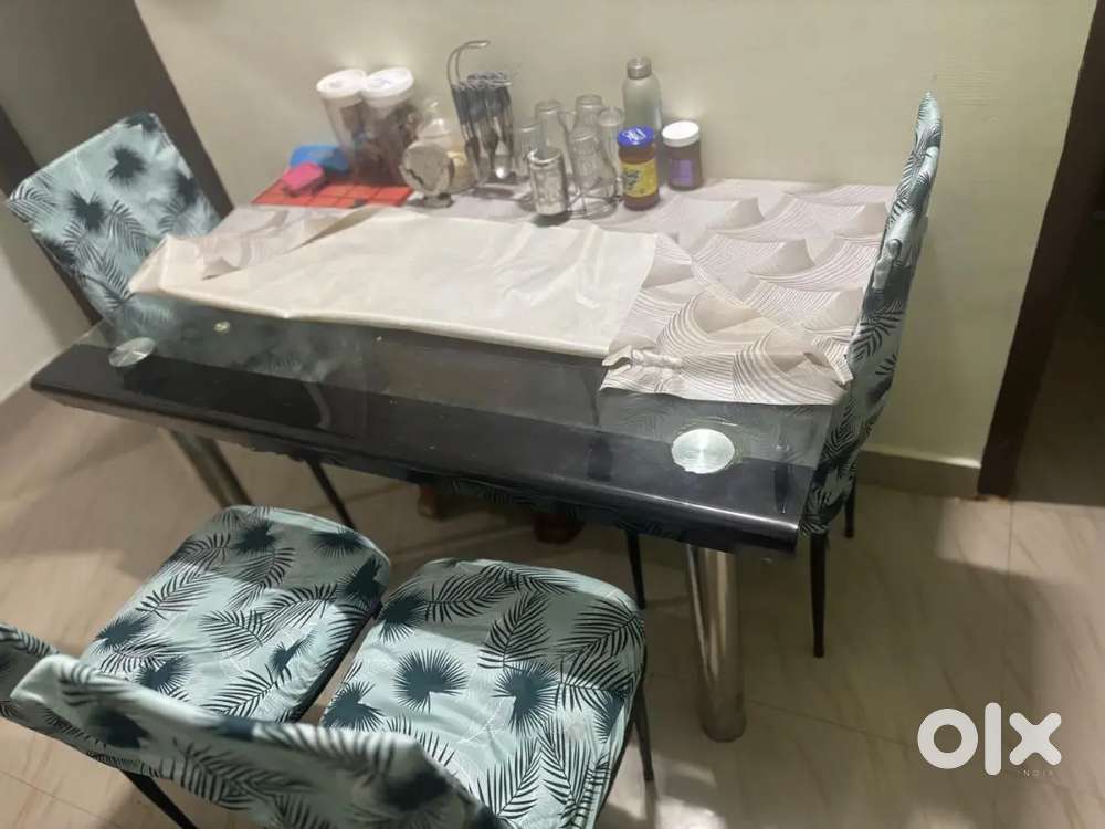 4 Chair dining table good condition one year old