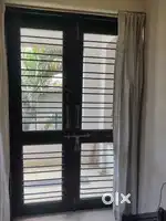 Teak wood french doors & aluminium sliding window