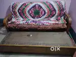 wooden sofa with bed in good condition