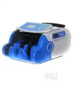 Money counting machine with fake note detection