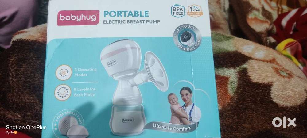 Portable electric breast pump