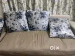 L shape 7 seater sofa with cushions.