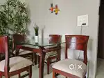 Solid wood dining table with glass top for sale
