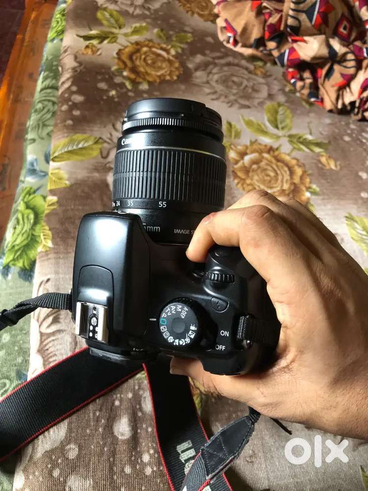 Canon EOS Kiss X5 DSLR with 18-55mm Lens, Charger & Strap