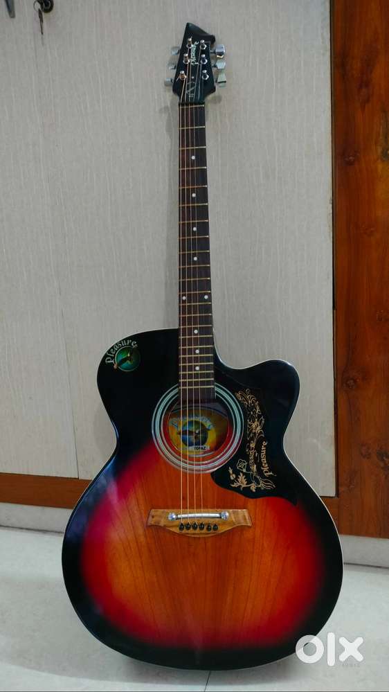 Guitar with premium (d'addario) string , 6 months old