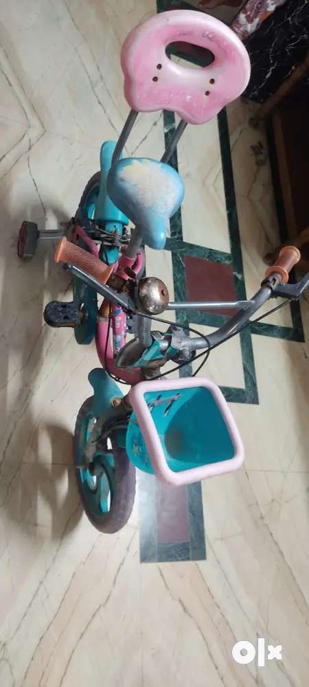 Kids cycle with side wheels and basket