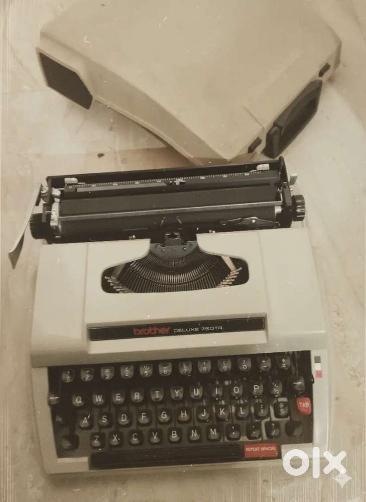 Old model typewriter 10000/-