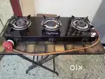Auto ignition 3 burner glass top stove with regulator for sale.