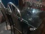 New Condition Stainless Steel Glass Top Dining with 4 Chairs.