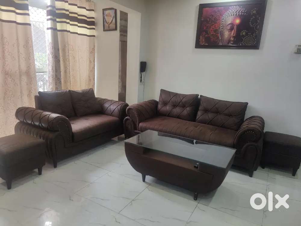 Sale of 5 seater sofa with 2 puffy and table